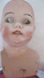 antique doll head before repair